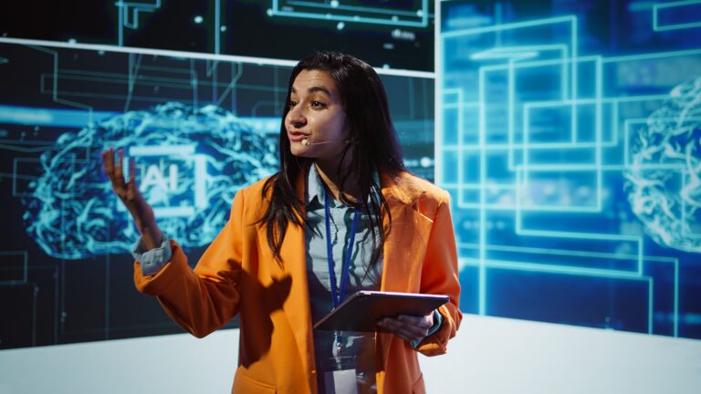 Public speaker doing presentation at tech forum event