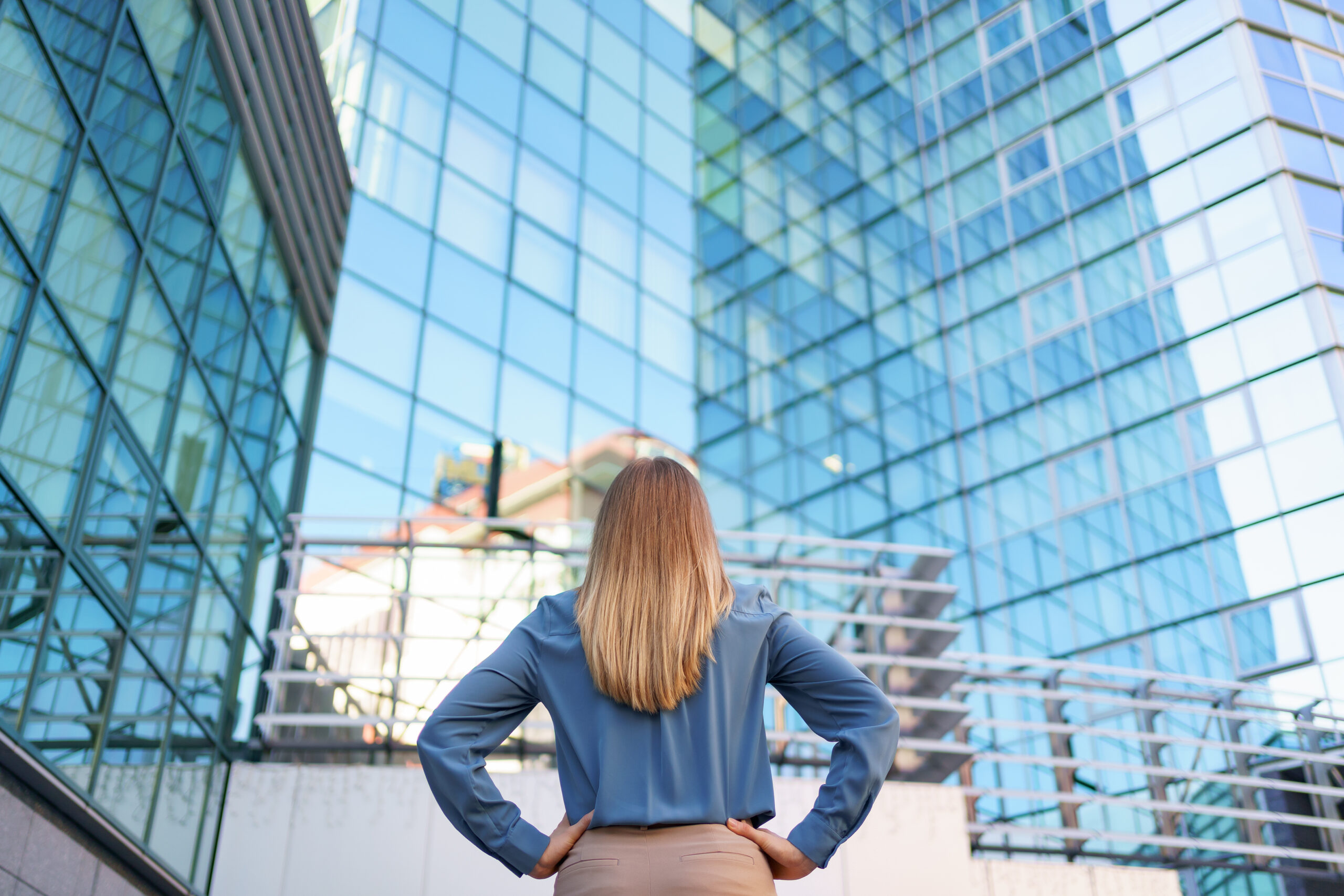Back view woman looking business building